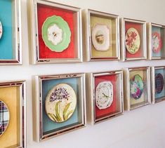 there are many framed pictures on the wall with different designs and colors to choose from