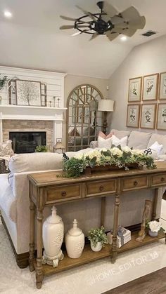 a living room filled with furniture and a fire place in the middle of the room