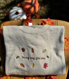 Discover the perfect blend of comfort and style with our embroidered clothing. All of my products are made to order, by me, at home in my little mini studio! I am committed to ensuring every item is top quality, long lasting and made with care. Embrace the essence of fall with our cosy Autumn Leaves Sweatshirt. Crafted from the softest blend of cotton and polyester, this sweatshirt promises comfort and warmth as the temperatures drop. The design features a stunning array of autumn leaves in rich Fall Cotton Sweatshirt With Floral Embroidery, Cozy Cotton Sweatshirt With Embroidered Text, Cute Embroidered Text Tops For Fall, Cute Tops With Embroidered Text For Fall, Fall Sweatshirt With Embroidered Graphics For Everyday, Everyday Fall Sweatshirt With Embroidered Graphics, Cute Custom Embroidered Tops For Fall, Cute Floral Embroidery Sweater For Fall, Cute Tops With Custom Embroidery For Fall