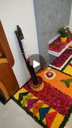 a room with flowers and decorations on the floor