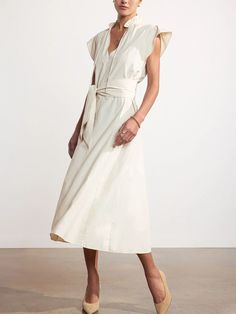 Brochu Walker - $348.00 | A special new addition to our sought-after dress collection, our Newport Midi Dress is the epitome of easy femininity. A richly detailed, panel seamed body with godets, a notched vee, ruffled neckline and pintuck pleats at the shoulder that culminate into a sleeveless ruffle define this midi dress, while signature Brochu Walker details like a self, removable belt add versatility. #brochuwalker #springfashion #AD Chic V-neck Dress With Belted Cuffs, Spring V-neck Dresses With Belted Cuffs, Fitted Belted Dress With Flutter Sleeves, Chic Midi Dress With Flutter Sleeves For Work, Chic Flutter Sleeve Midi Dress For Work, Chic Workwear Midi Dress With Flutter Sleeves, Chic Belted A-line Sleeveless Dress, Chic Belted Midi V-neck Dress, Chic Belted V-neck Midi Dress