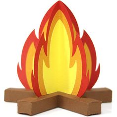 a paper model of a fire with red and yellow flames on it's sides