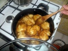 someone is cooking food in a pan on the stove