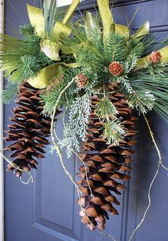 two pine cones are hanging from the front door