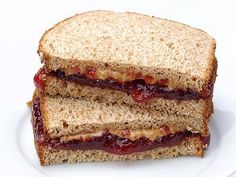 two halves of a peanut butter and jelly sandwich stacked on top of eachother