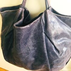 This Slouchy Bag Is Perfect For Your Everyday Out, The Gym, The Office Or Weekend Getaway. The Bag Features A Supple Textured Leather, Zip Top Closure, One Interior Zip Pocket, Two Slip Pockets Perfect For Your Phone And Tissues And A Dustbag! It’s Sized To Hold The Essentials From Your Laptop To Your Gym Shoes Or Both. This Versatile Bag Be Styled And Used In Many Ways! Italian Brand Gianni Chiarini Is Always Timeless, Feminine And Sophisticated Classic! Brand: Gianni Chiarini Size: One Size Ma Slouchy Bag, Greyish Blue, Weekend Bag, Gym Shoes, Weekend Getaway, Purple Grey, Weekender Bag, Zip Top, Blue Purple