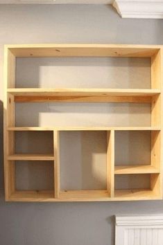 an empty shelf in the corner of a room