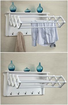 two white shelves with blue vases and towels hanging on the wall next to each other