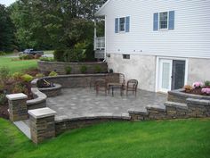 an outdoor patio with steps and seating area