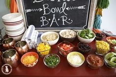 a table topped with bowls filled with different types of food