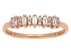 a rose gold ring with baguets and diamonds