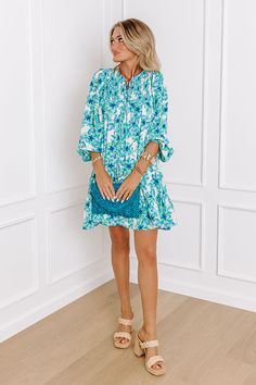 - Make memories one mimosa at a time in this darling dress! - Lightweight material with a floral print and a built-in skirt lining - A v-cut neckline with a tie - A smocked detail - Long, loose sleeves with elastic cuffs - A flowy silhouette that ends in A mini dress length hemline Measurements S : Bust 34", Hip 42", Length 34", Sleeve Length 23.5", Waist 38". M : Bust 36", Hip 44", Length 34", Sleeve Length 23.5", Waist 40". L : Bust 38", Hip 46", Length 35.5", Sleeve Length 24", Waist 42". Turquoise V-neck Mini Dress For Vacation, Turquoise V-neck Summer Dress, Turquoise V-neck Mini Dress For Summer, Green Mini Dress For Brunch, Green Mini Length Dress For Brunch, Green V-neck Dress For Garden Party, Green Knee-length Floral Dress For Vacation, Summer Green Floral Long Sleeve Dress, Green Mini Floral Dress For Garden Party