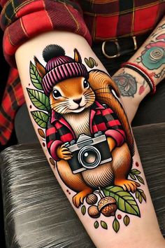 a person with a tattoo on their arm holding a camera