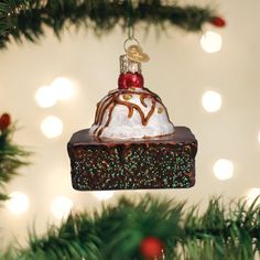 a chocolate cake ornament hanging from a christmas tree