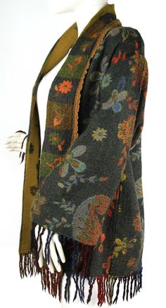 This is a J. Peterman Company wool paisley & floral patterned multi-colored kimono style open front sweater with fringed hem and sleeves, size 6. This sweater is in excellent condition and has lined cotton sleeves. Appears to be generously sized (please see measurements); Length (from top of shoulder to bottom front hem): 31"-includes fringe Chest (pit to pit): 23" across Waist: 22" across Bottom hem: 20" across Sleeves (from top of shoulder seam to cuff): 19" & 23" with fringe Back shoulders (s Wizard Ideas, Wizard Fashion, Strip Quilt Patterns, Fringe Sleeves, J Peterman, Kimono Style Jacket, Clothing Reference, Front Sweater, Fashion Boho