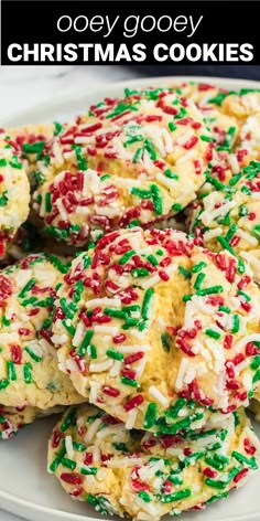 christmas cookies with sprinkles on a white plate