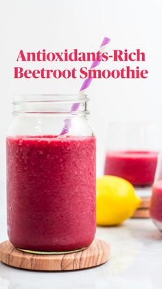 a glass jar filled with beetroot smoothie