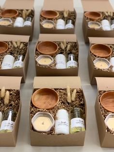 six boxes filled with candles and wooden spoons