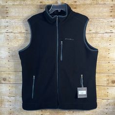 - New With Tags / Never Used / Excellent Condition - Fleece Material - Minimal Stretch - Warm And Comfy - Full Zip - Zippered Pockets - Chest Pocket - Black / Dark Grey Color With Blue Trim - 24 Pit To Pit - 29 Length - Fast-Shipping - Pet-Free / Smoke-Free Home Outdoor Black Fleece Jacket With Zipper Closure, Black Fleece Jacket With Zipper For Cold Weather, Black Fleece Jacket With Zipper For Outdoor, Casual Black Fleece Jacket For Layering, Black Fleece Jacket For Winter Layering, Eddie Bauer Jacket, Blue Trim, Dark Grey Color, Fleece Vest