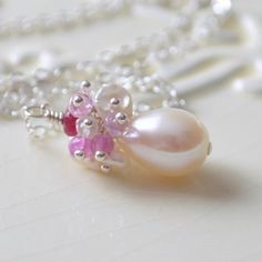 This bridal necklace is a perfect choice for a traditional wedding, where the bride wants just a touch of colour. Its pink and ivory colour combination Elegant Pink Pearl Drop Necklace, Elegant Pink Necklace For Anniversary, Wedding Pearl Necklace With Gemstone, Feminine Silver Pearl Necklace For Wedding, Elegant Pink Birthstone Jewelry, Dainty Pink Necklace For Anniversary, Delicate Pink Jewelry For Anniversary, Elegant Pink Pearl Necklace For Anniversary, Elegant Pink Pearl Gemstone Necklace