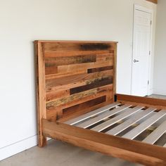 a bed frame made out of pallet wood with no headboard or foot board