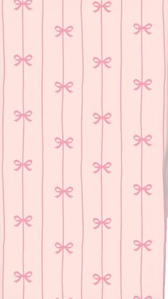 a pink and white wallpaper with bows on the lines in pastel pink color