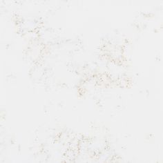 a white marble background with some brown speckles on the top and bottom half