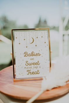 there is a sign that says babies are sweet please take a treat on the table