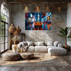 a living room filled with furniture next to a wall mounted painting on the side of a wall