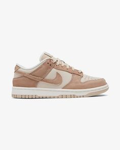 The Nike Women’s Dunk Low SE ‘Sandrift’ pairs elevated materials with a muted color scheme. The hoops shoe turned wardrobe staple carries a taupe-colored leather upper with beige suede overlays accented with contrast stitching. Embossed Nike branding appears on the heel tab and the stitched tag that adorns the leather Pretty Sneakers, Trendy Shoes Sneakers, Preppy Shoes, Pretty Shoes Sneakers, All Nike Shoes, Cute Nike Shoes, Cute Sneakers, Hype Shoes, Girly Shoes