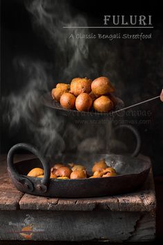 the food is being cooked in an iron skillet with steam coming out of it