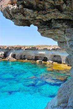 the water is crystal blue and clear at this point in the cliff near the beach