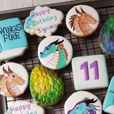 decorated cookies are on a cooling rack with the numbers 11, 11, and 11