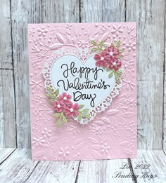 a valentine's day card with pink flowers and white heart on the front, which says happy valentine's day