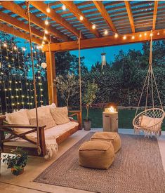 an outdoor living area with swings and lights