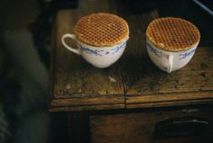 two waffle cups sitting on top of a wooden table