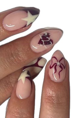 Almond-shaped nails with red and white art on a pink base, featuring red ribbon bow designs, stars and abstract patterns. [Get the look: NO. 068 ROMAN EMPRESS, NO. 026 ULTRA WHITE, NO. 002 BLUSH GOWN] Inspiration: candyclawss on Instagram. #starnails #bownails #abstractnails Swirly Red Nails, Nail Art Professional, Biab Nail Art Almond, November Red Nails, Almond Funky Nails, Nails Design 2024, Pink And Red Nail Art, Nails With Red And White, Fine Line Nail Art