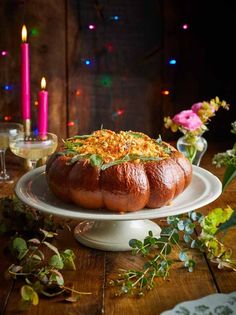 a table topped with a cake covered in toppings