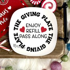 the giving plate says enjoy refill pass along with candy canes and candies