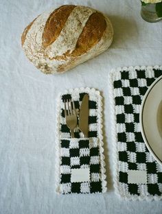 a table set with bread, fork and knife