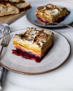 a piece of cake sitting on top of a plate next to a fork and knife