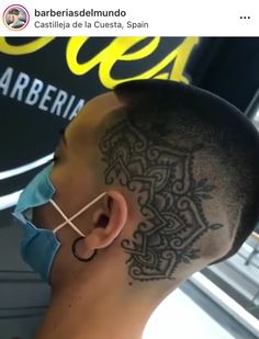 a man with a tattoo on his head