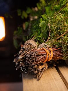 a bunch of twigs sitting on top of a wooden table