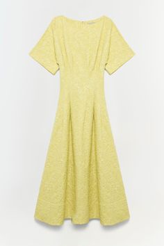 PRE-FALL 2024 WOMEN'S COLLECTION The Rosalie Dress in Citrine. This short-sleeve midi is a charming blend of simplicity and grace. Crafted in a cheerful yellow hue, it features a light texture that adds a tactile dimension to the garment. The dress is cut with a modest round neckline and elbow-length sleeves, offering a balanced coverage that suits various occasions. Swim Gifts, January Jones, Knitwear Tops, Light Texture, Elbow Length Sleeve, Fall 2024, Pre Fall, British Indian, Yellow Dress