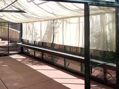 the inside of a greenhouse with glass walls