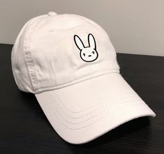 Bad Bunny Dad Hat. 100% Washed Cotton, Unstructured Vintage Style Cap. Adjustable buckle strap closure. Hat Baseball, Bad Bunny, Marketing Design, Dad Hat, Dad Hats, Baseball Cap, Vintage Style, Baseball Hats, Vintage Fashion