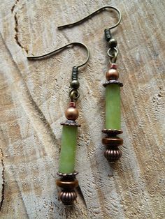 Dangle earrings, bohemian style, made of jade, hematite, bronze, copper and a tiny czech glass bead of antique gold color. Those earrings are very light and perfect for everyday wear. They will also make a beautiful gift and will come in a soft linen pouch, or, if you choose the gift wrapping option, in a small gift box, ready for gift giving. The ear wire is nickel, cadmium and lead free. A matching necklace will soon be available. The order is dispatched within 72 hours after receipt of paymen Bohemian Jade Wire Wrapped Earrings, Bohemian Jade Earrings, Nickel Free Bohemian Jade Earrings, Bohemian Nickel Free Jade Earrings, Bohemian Jade Earrings With Ear Wire, Boho Earrings Diy, Antique Bronze Jewelry, Linen Pouch, Natural Stone Earrings