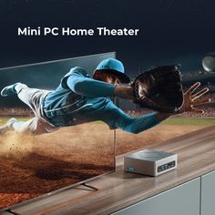 a tv with a baseball player on it and the words mini pc home theater above it