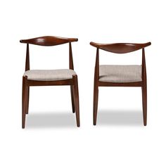 a pair of chairs sitting next to each other on a white background with no one in it