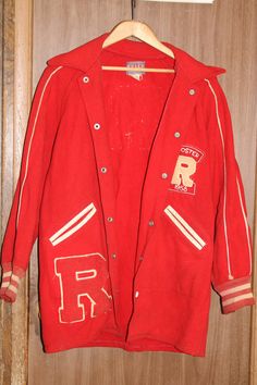 "Vintage 1950's Randolph Cardinals Varsity Letter Wool Jacket in Original Condition ~ Free Shipping Here is a vintage Randolph Cardinals varsity letter wool jacket. The jacket is late 50s and has sewn letters and patches on the jacket. The jacket was made by Felco Athletic Wear and is 100% wool. The Randolph Cardinals are based out of Randolph High School in Randolph, NY. The jacket is marked size 38, in original condition and is looking for a loving home. The jacket has button snaps. The jacket's measurements are as follows: Length: 32\" Sleeve (inseam): 18\" Sleeve (outside): 24\" Chest: 19\" (38\") This jacket is in original condition and, as a result, may be fragile. The jacket will be wrapped in a bag and placed in a box to protect it from dust and debris, and to ensure protection dur Vintage Varsity Jacket With Long Sleeves For College, Vintage Long Sleeve Varsity Jacket For College, Retro Cotton Varsity Jacket For School, Retro Hooded Varsity Jacket For Fall, Vintage Cotton Varsity Jacket With Long Sleeves, Retro Wool Varsity Jacket For Fall, Vintage Long Sleeve Wool Varsity Jacket, Vintage College Outerwear With Pockets, Retro Winter Varsity Jacket